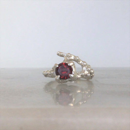 Sterling silver organic ring with red garnet