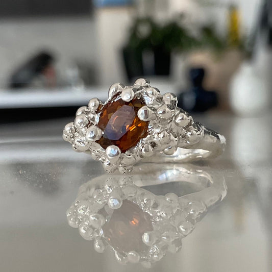 Oval orange tourmaline molten style ring