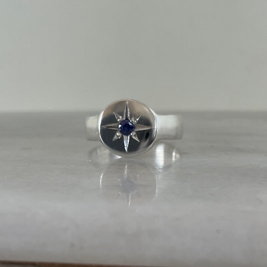 Signet ring set with a violet blue sapphire