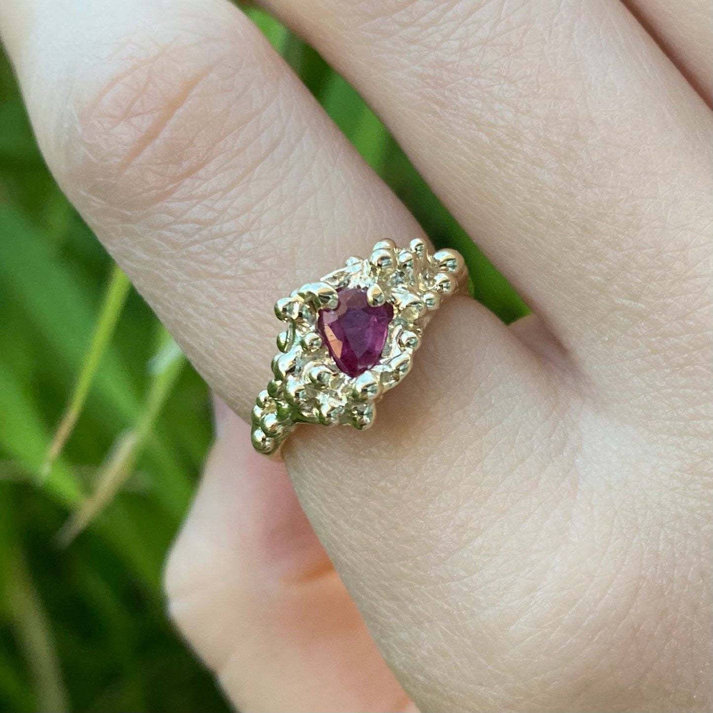 Ruby ring shown on hand