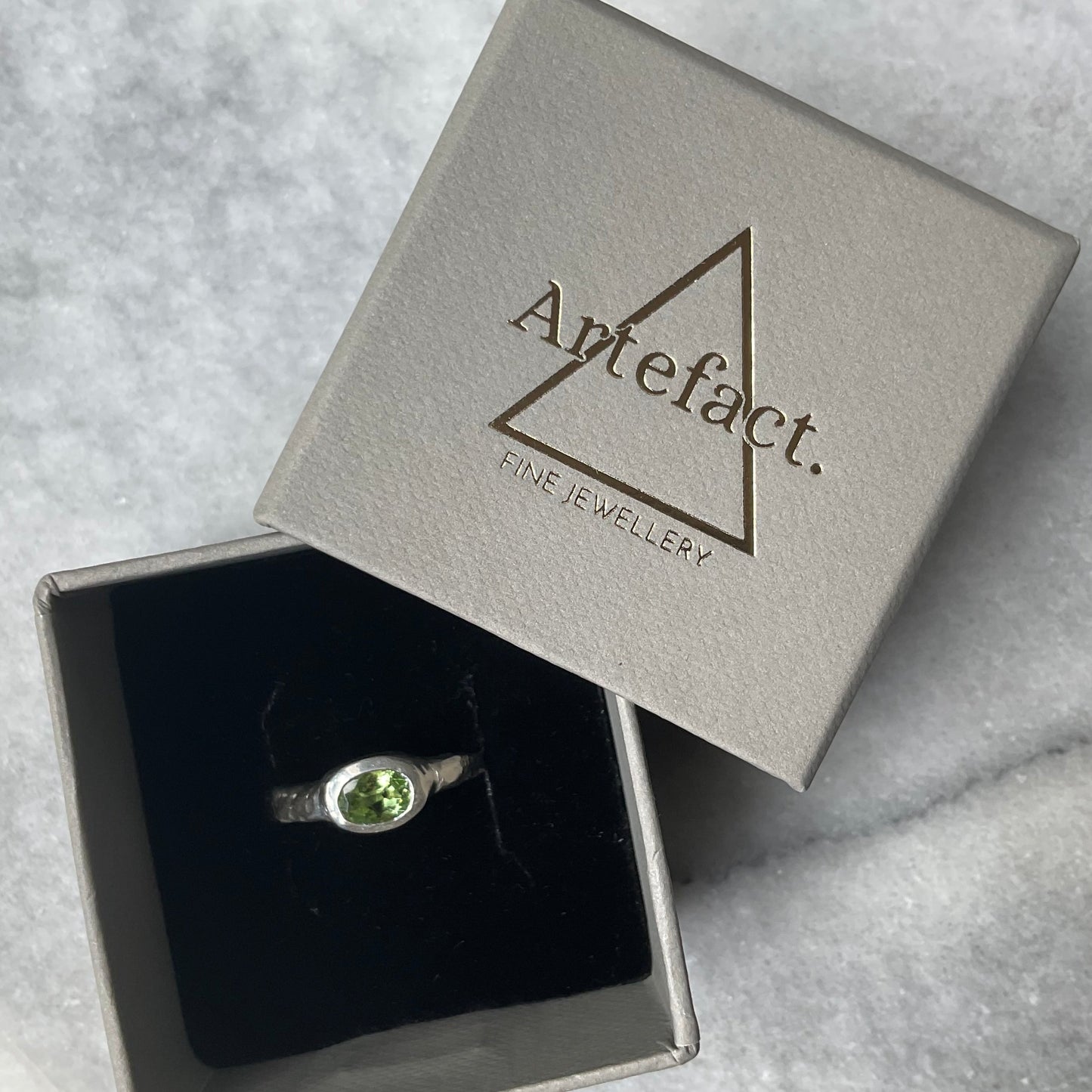 Green tourmaline ring by Artefact Fine Jewellery in ring box