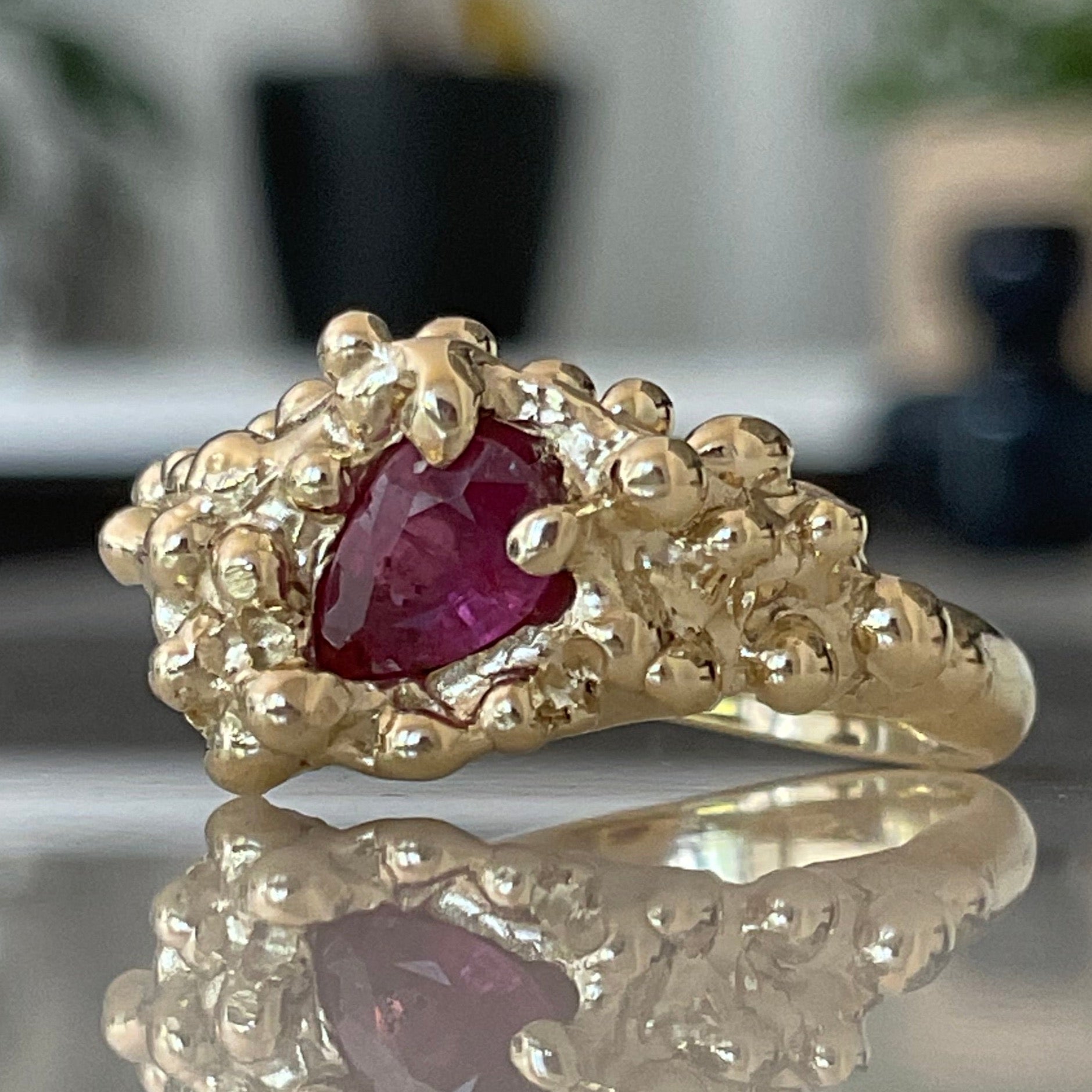 Molten solid gold ruby ring