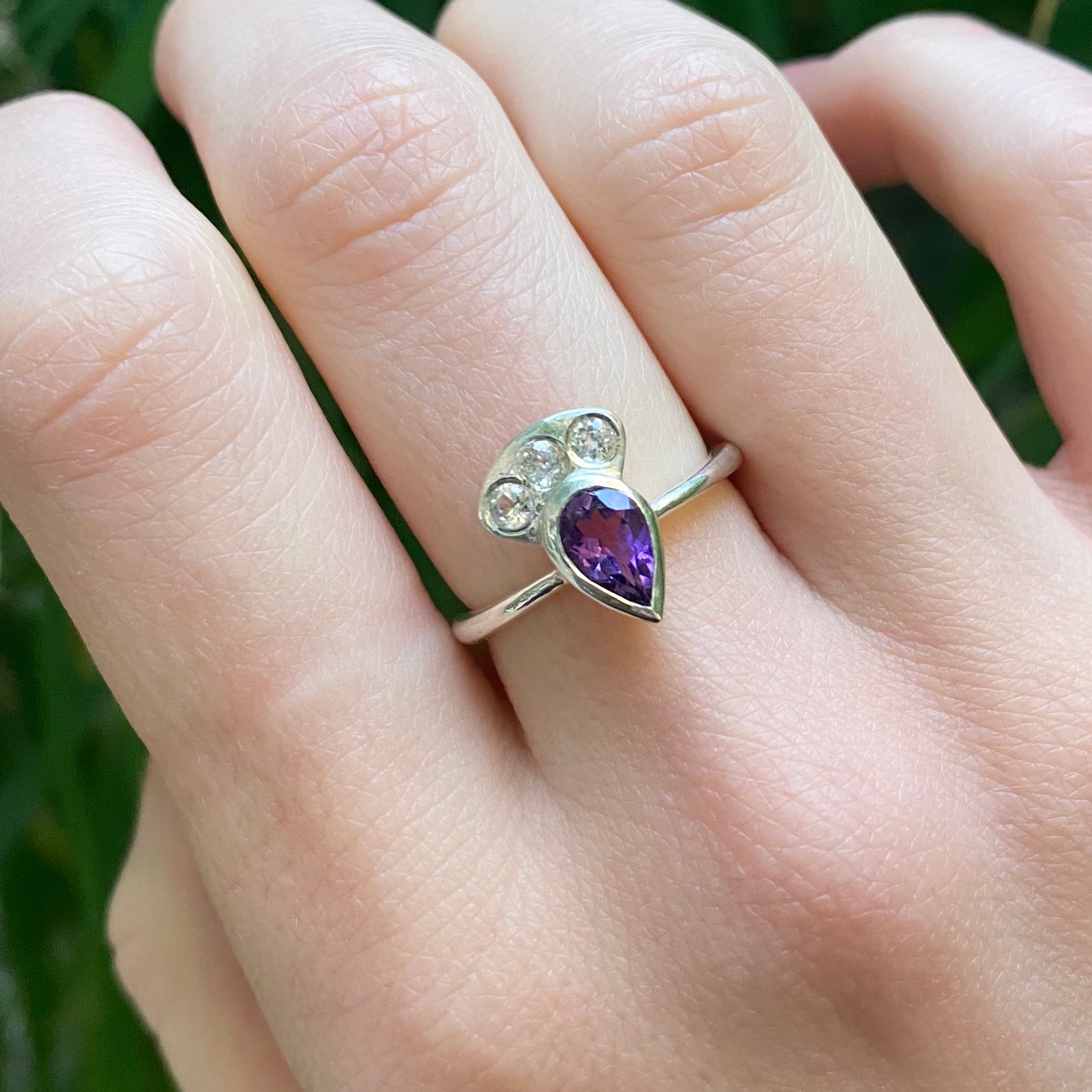 The Penelope Ring - a teardrop amethyst with three white topaz in a sterling silver ring band.