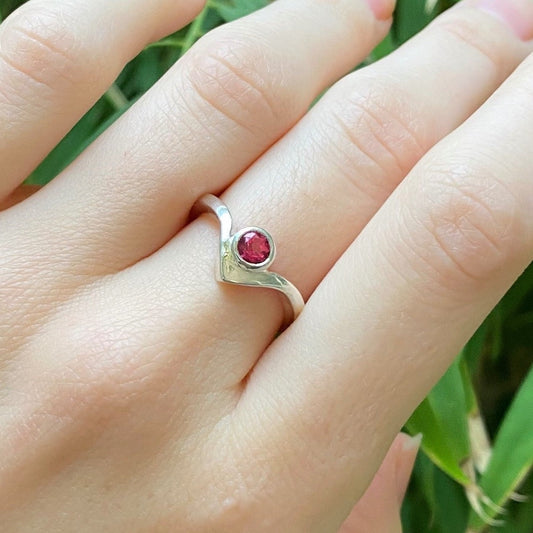 Pink topaz wishbone ring on model