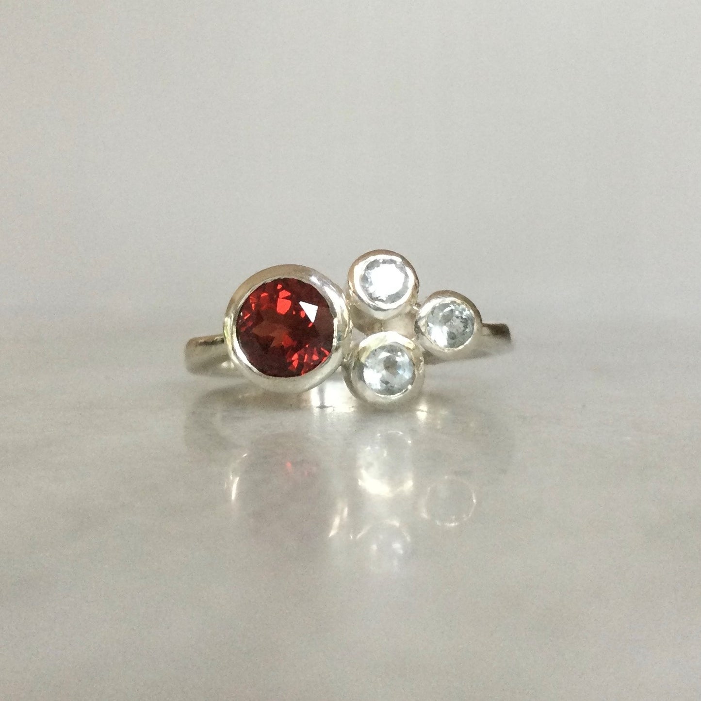 Garnet and topaz cluster ring