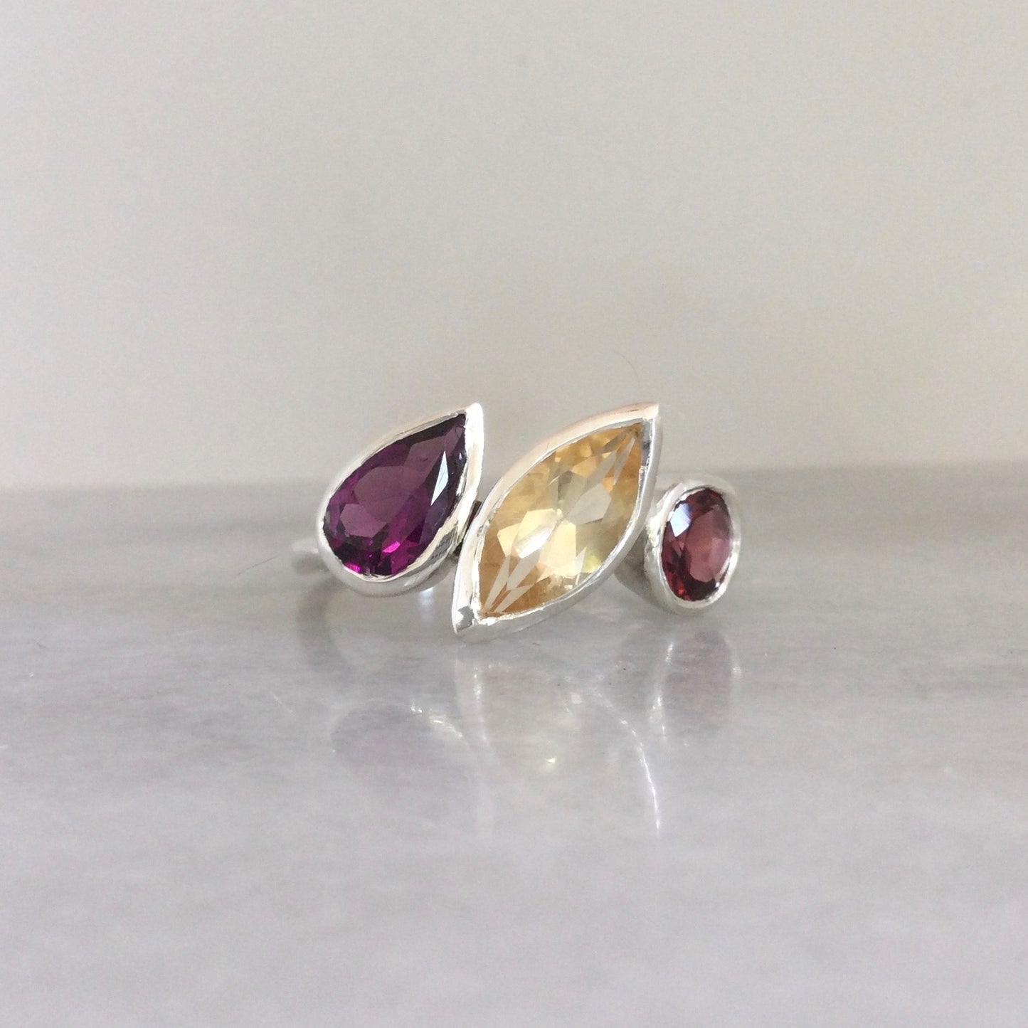 Three stone marquise and garnet ring